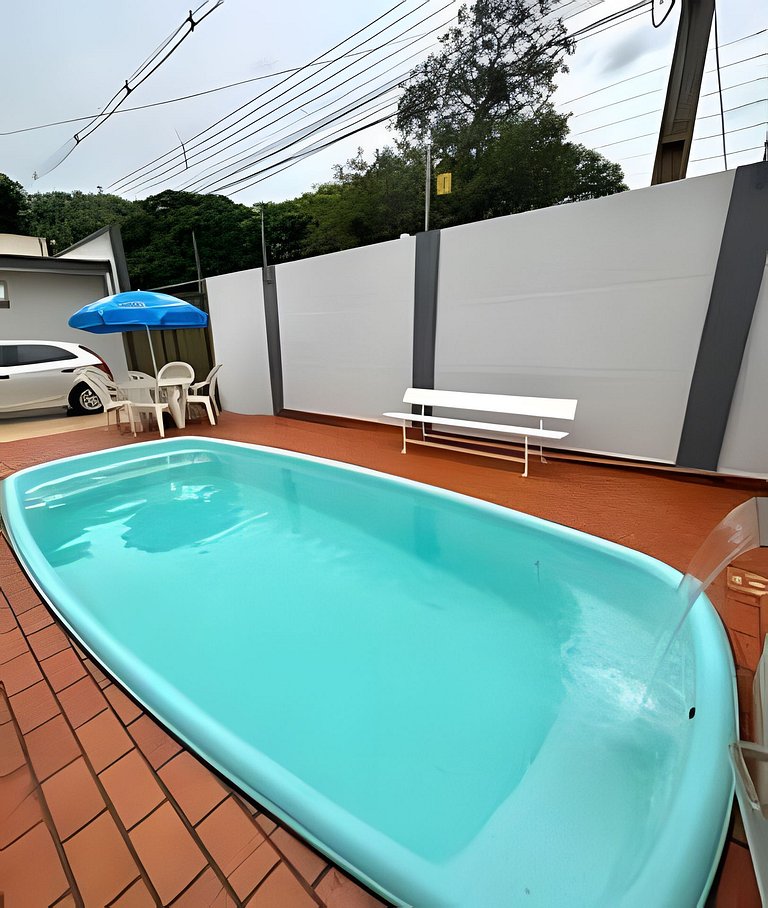 Casa com 3 suites piscina ar 1 km Shopping JL